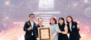 Five professionals pose on a stage holding a framed award in front of a backdrop that reads ASEAN RECORDS and celebrates regional excellence, thumbs up all around
