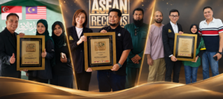 Group of people posing with framed certificates at an ASEAN Records awards backdrop; several flags visible on the left and a large 'ASEAN RECORDS' sign in the center.