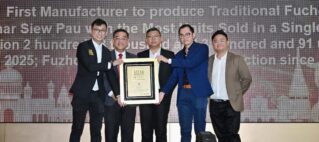 Five men in suits pose on a stage, holding a framed award with a large ASEAN RECORDS backdrop behind them.